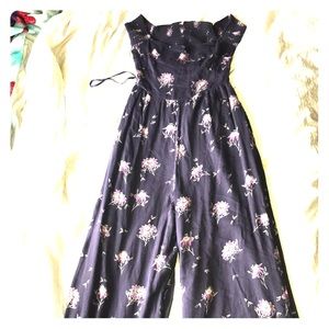 One piece long legged jumper with flowers on it